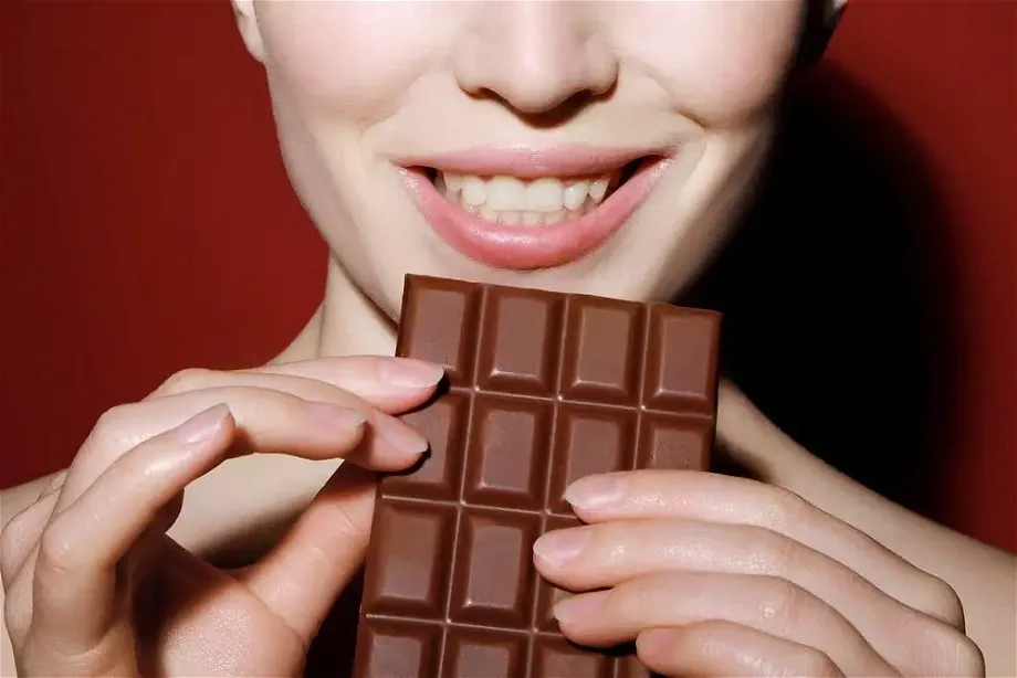 woman holding a chocolate
