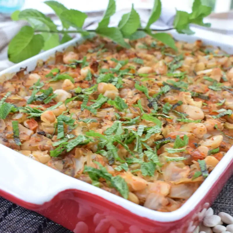 ¾ view of baked cabbage and bean casserole