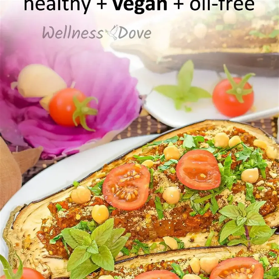 Hearty and tasty Chickpea and Tomato Stuffed Eggplant recipe! Full of flavor and fresh seasonal vegetables, you are going to love this recipe. It is 100% vegan, prepared with only whole plant-food ingredients. Super delicious filling with a chewy texture from the mashed chickpeas!
