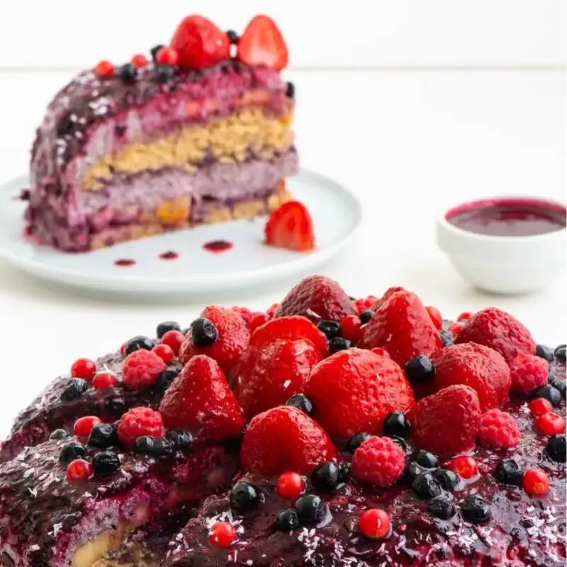 Super juicy and fresh whole plant foods cake. No sugar and no oil! It is filled with fresh fruits and layered with this fantastic, creamy blueberry frosting! All this covered with the tastiest blueberry topping ever! This cake is a perfect dessert for any occasion or whenever you need something sweet and healthy!