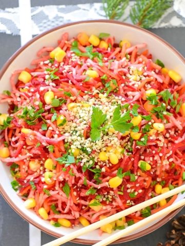 A bowl of shredded vegan salad overhead view