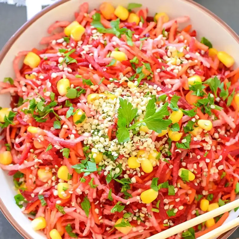 A bowl of shredded vegan salad overhead view