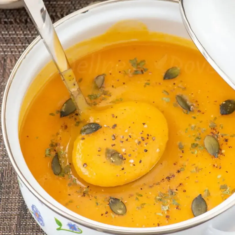 ¾ shot of a pot full of curried sweet potato parsnip soup