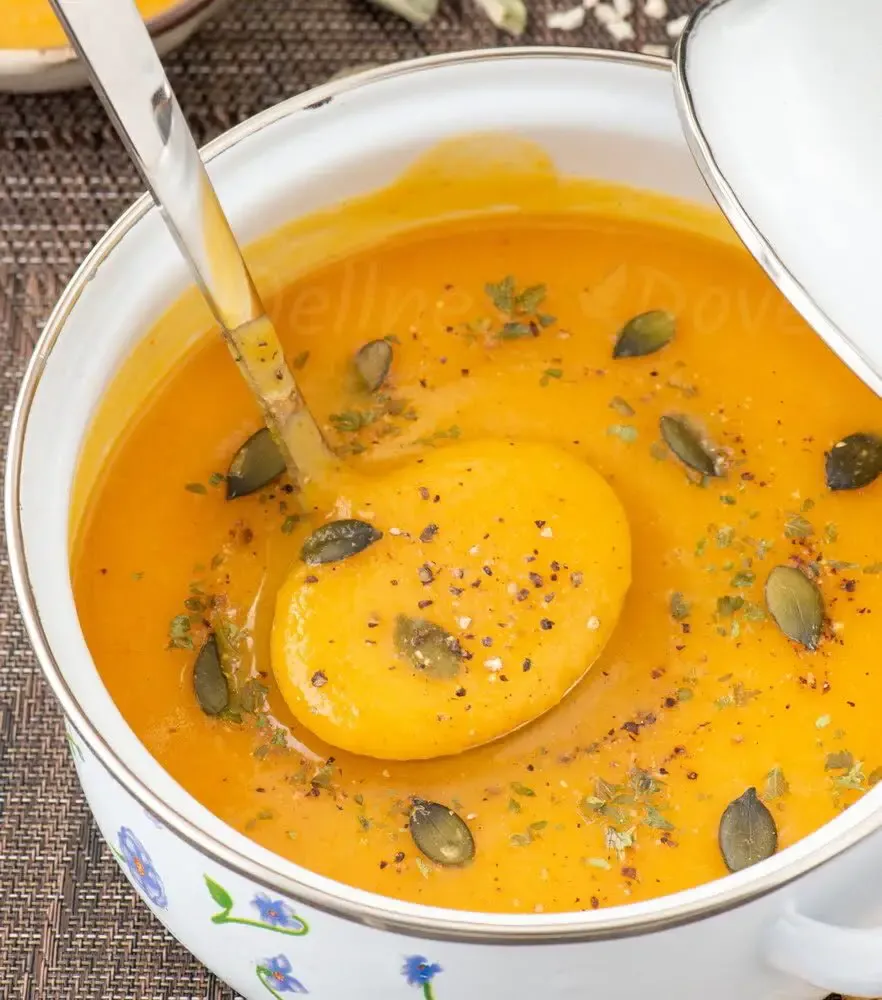 ¾ shot of a pot full of curried sweet potato parsnip soup