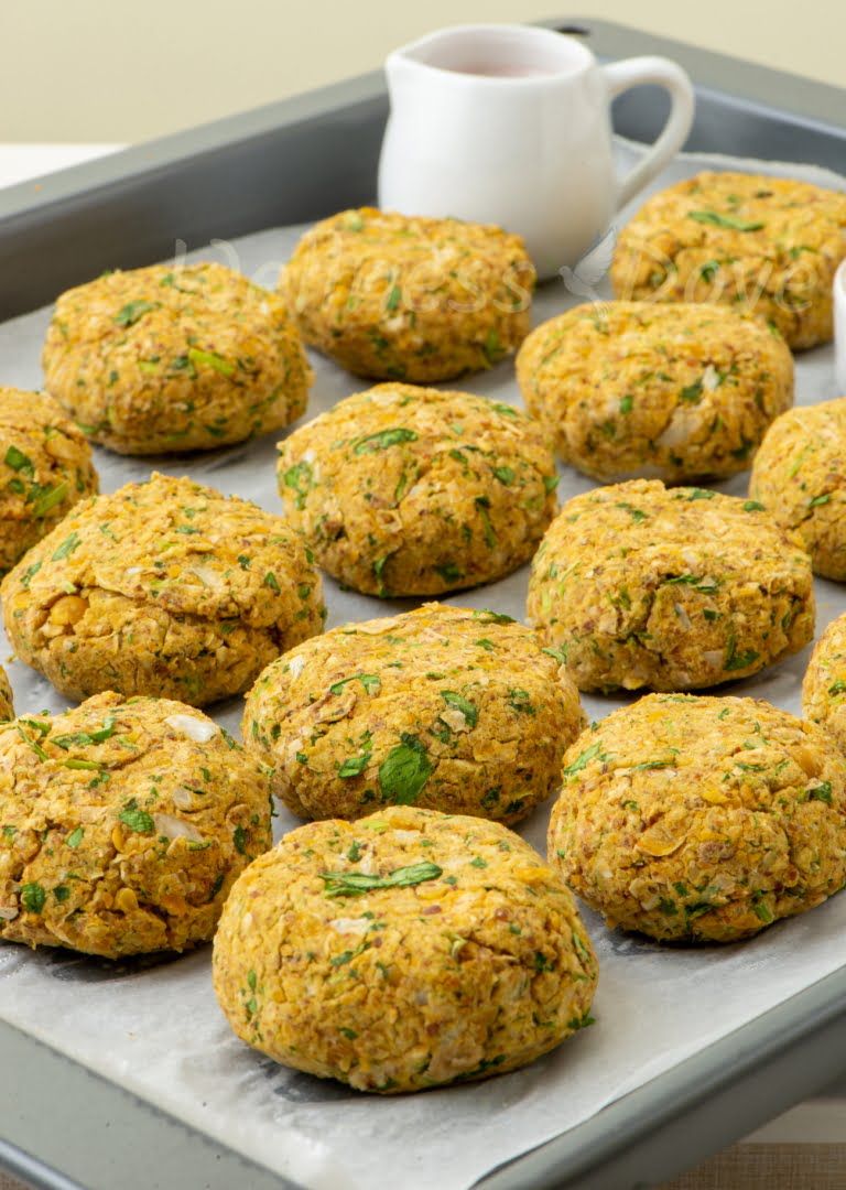 a baking tray with homemade falafels