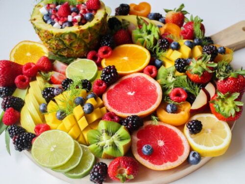 a board full of different chopped fruits