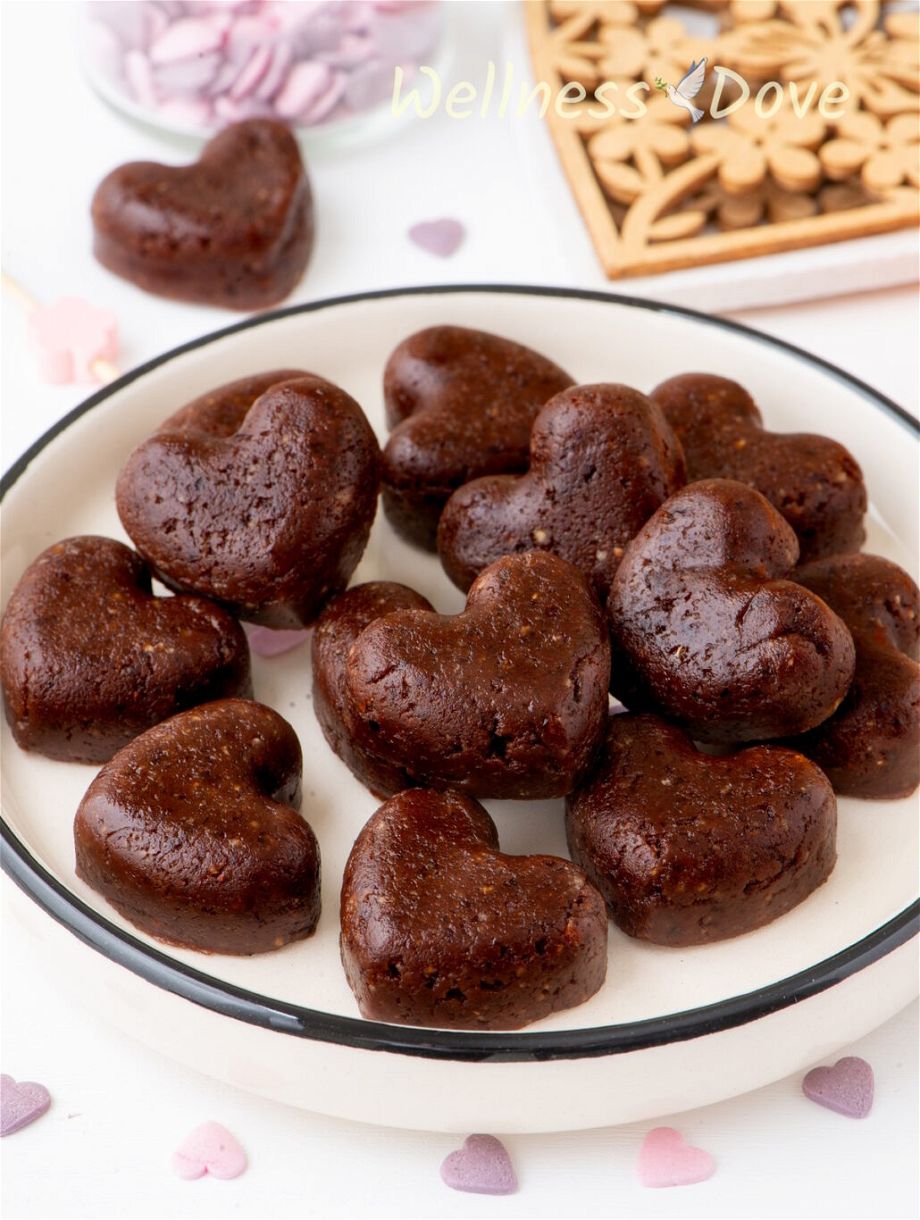 a close up view of the healthy vegan brownie hearts in a small plate