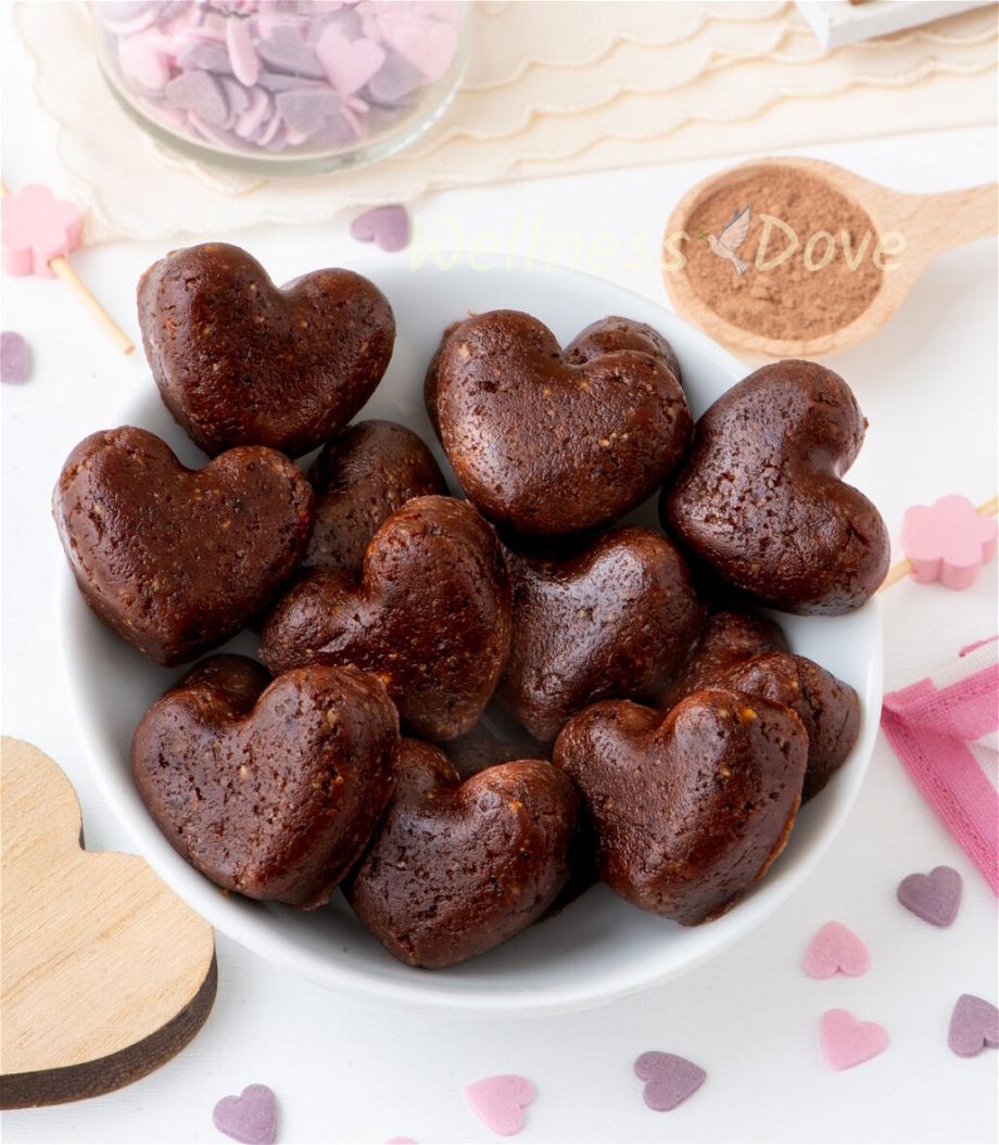 a close up view of the healthy vegan brownie hearts, place in a small bowl