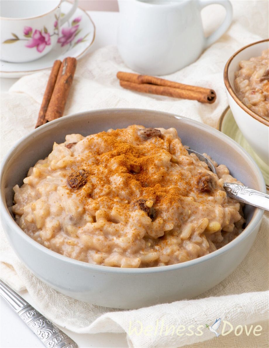 a 3/4 view of the  quick vegan brown rice pudding in a grey bowl