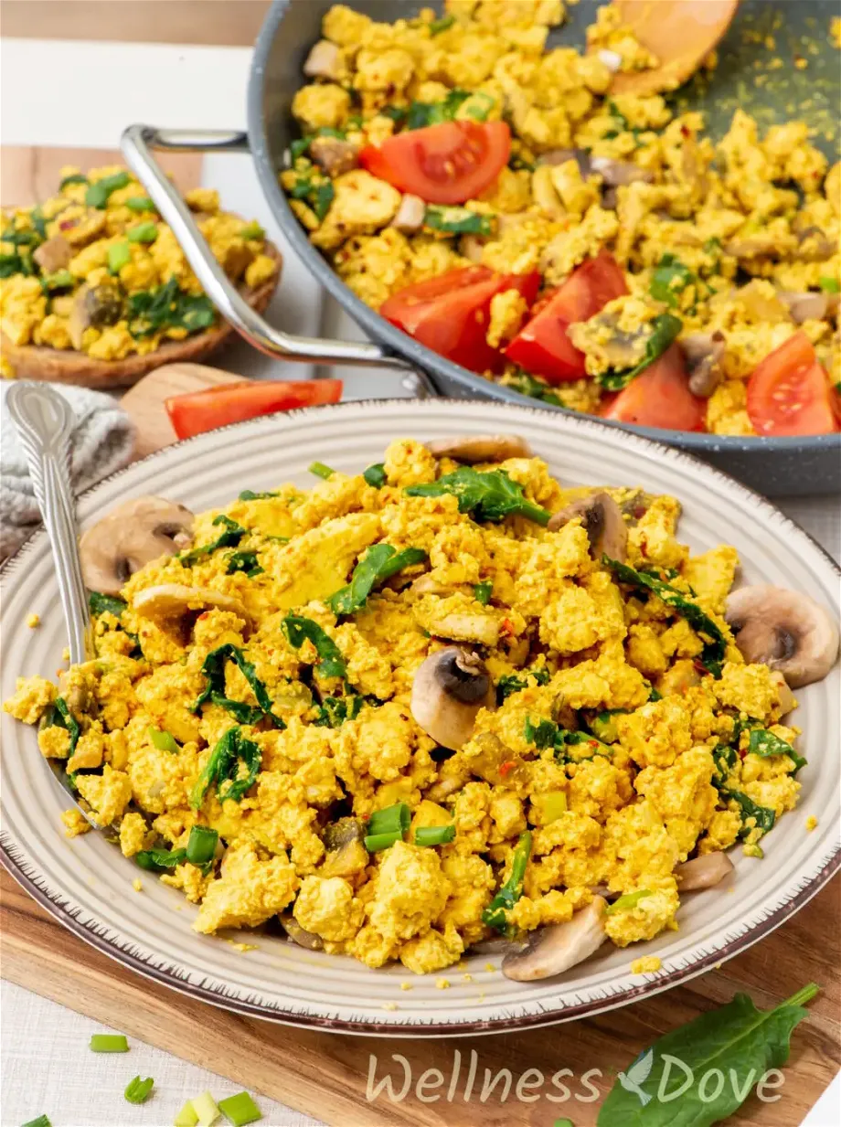 the Vegan Tofu & Spinach Egg Scramble in a plate from a 3/4 angle