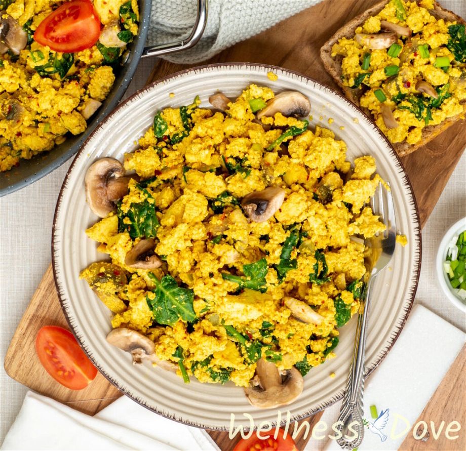 an overhead view of the Vegan Tofu & Spinach Egg Scramble in a plate