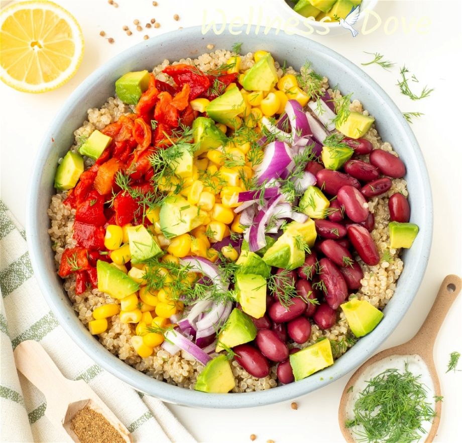 the vegan avocado quinoa salad is untossed and put in a bowl