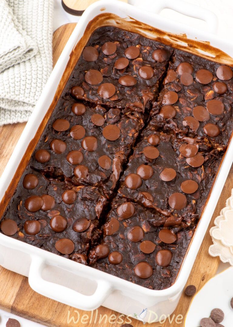 the Vegan Brownie Baked Oatmeal in a baking dish and is cut into pieces