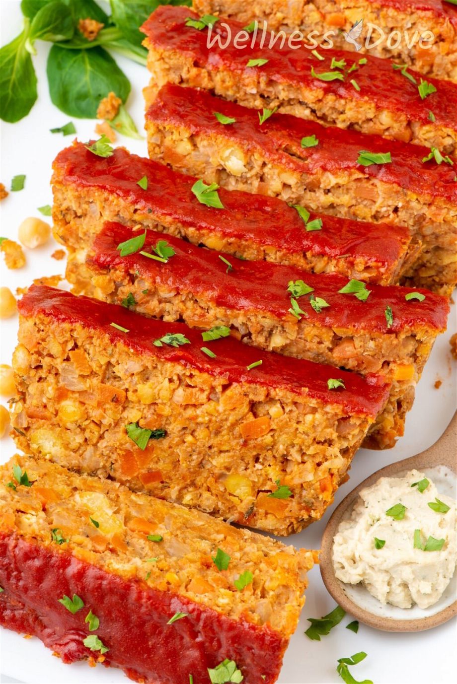 a macro shot of the vegan chickpea meatloaf cut into 9 pieces