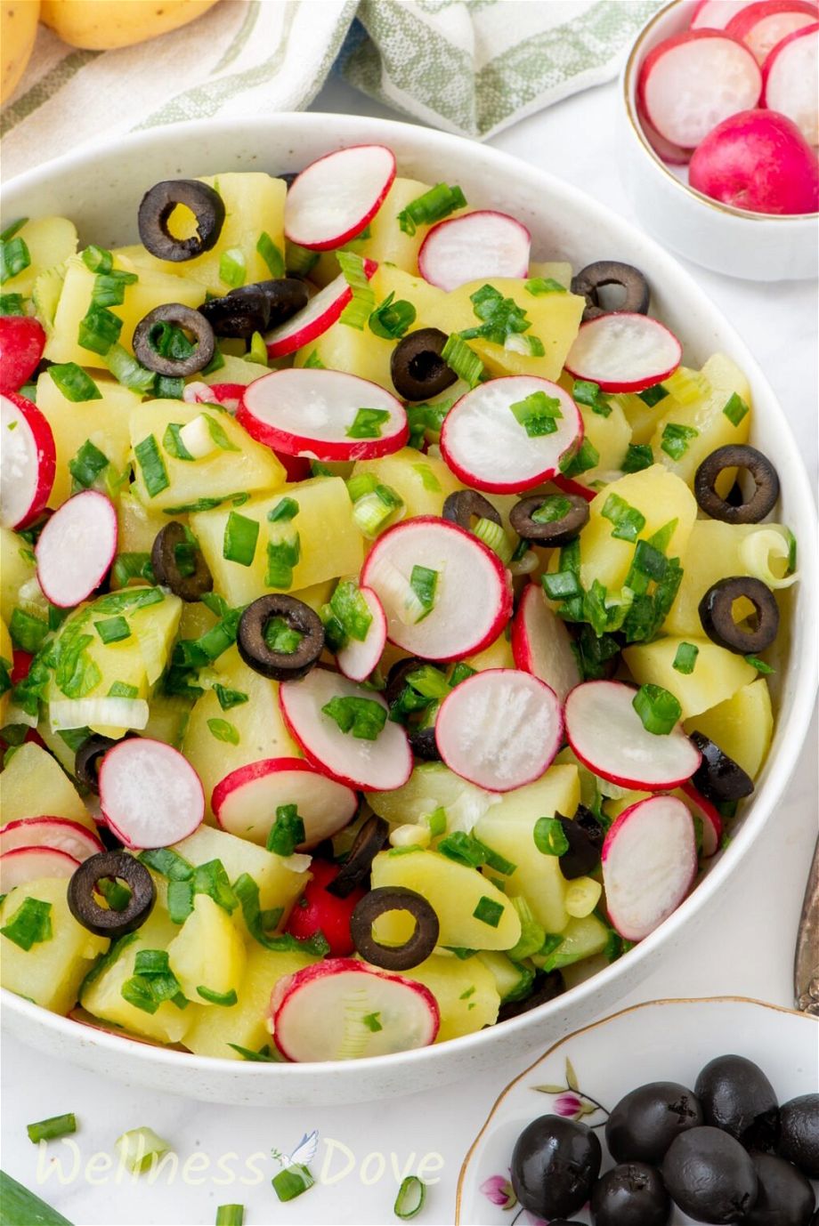 the vegan no mayo potato salad in a large bowl, close up view