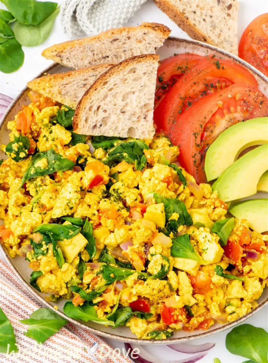 a 3/4 angled shot of the quick curried tofu vegan egg scramble in a plate