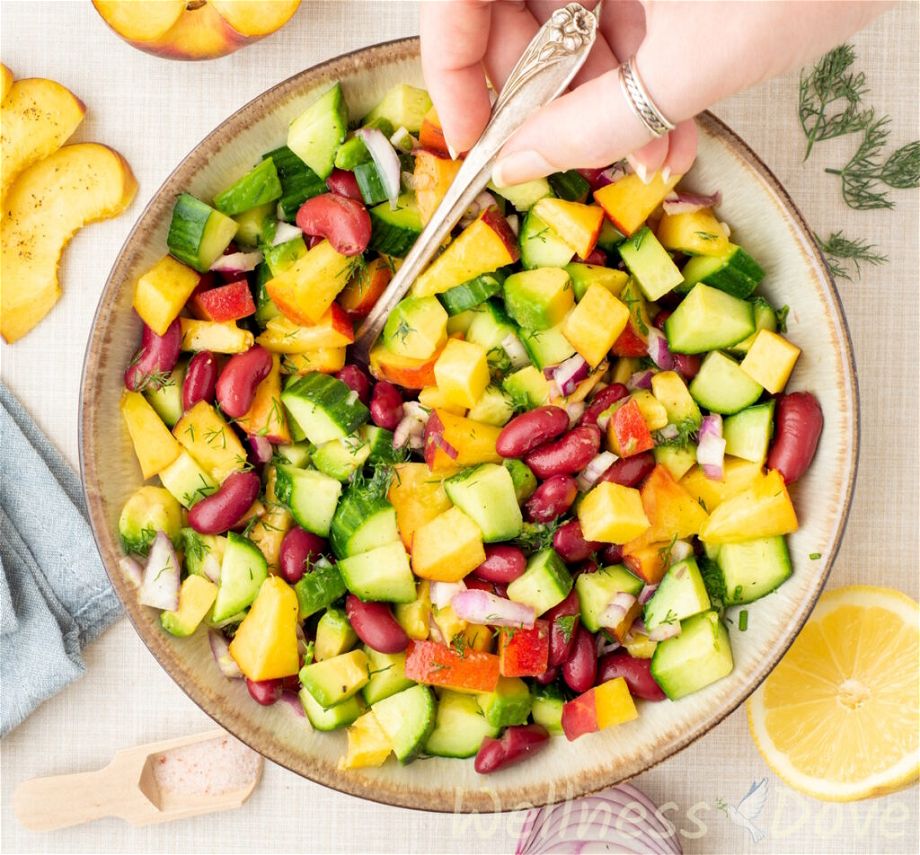overhead view of the vegan peach salad with beans in a bowl
