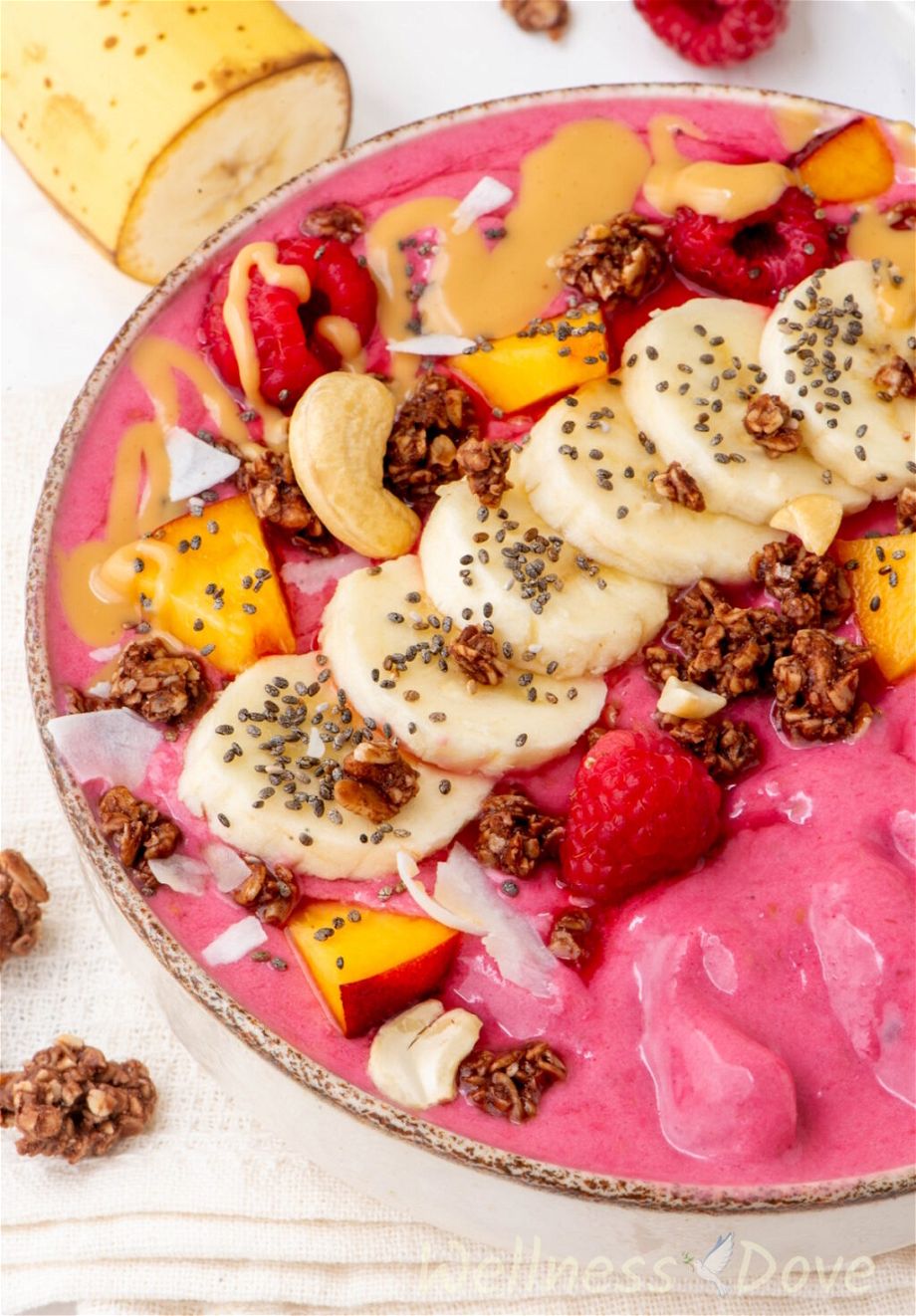 a macro shot of the Raspberry Banana Vegan Smoothie Bowl from a 3/4 angle