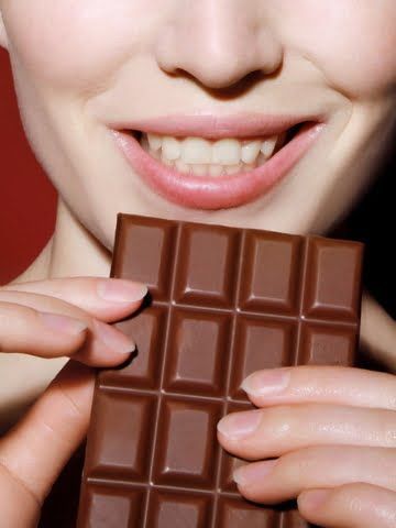 woman holding a chocolate