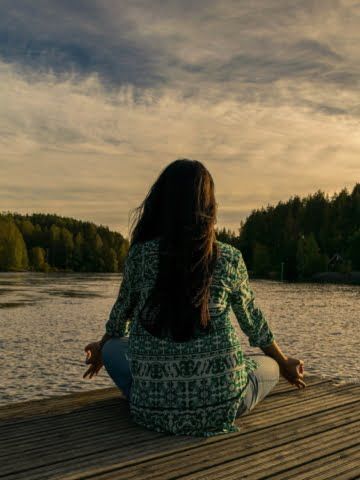 a woman meditates