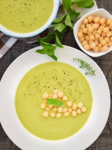 overhead shot of a plate full of vegan green peas cream soup