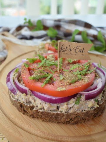 ¾ shot of a vegan sandwich with zucchini dip