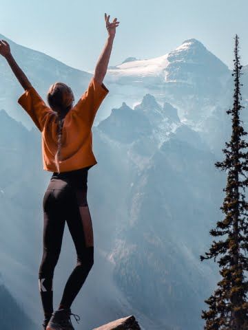 a woman greeting nature