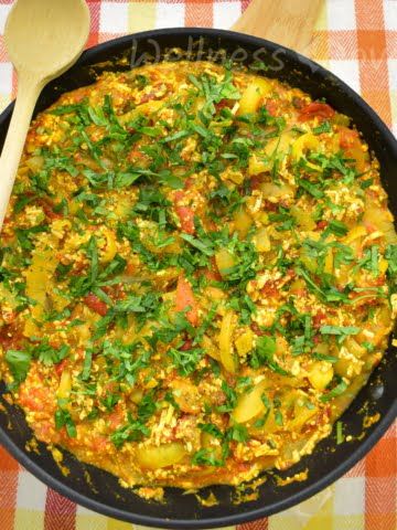 overhead shot of a pan full of cooked scrambled tofu with Roasted peppers