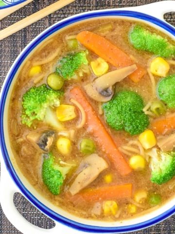 A bowl of vegan miso broccoli soup overhead shot