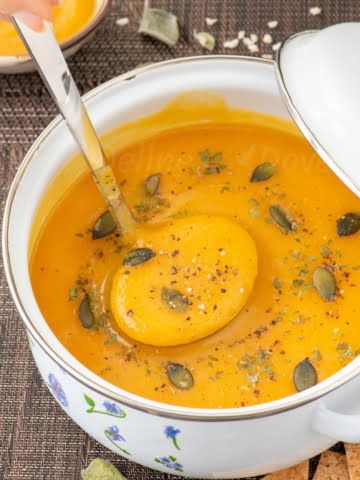 ¾ shot of a pot full of curried sweet potato parsnip soup