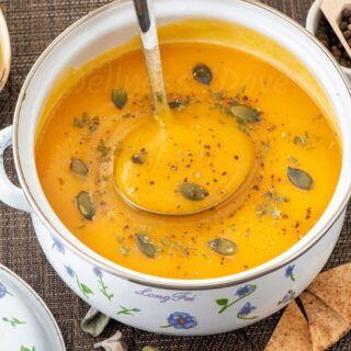 ¾ photo of a pot full of sweet potato parsnip soup