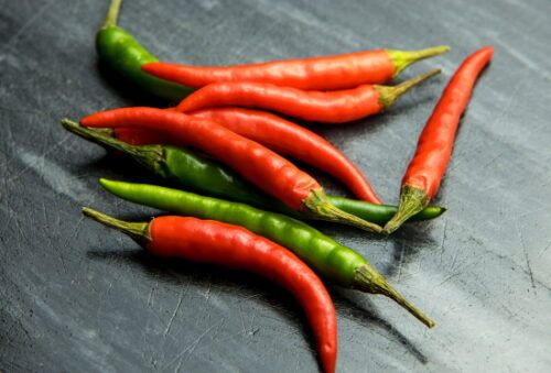 chili peppers on a board