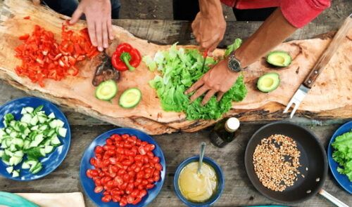 people chopping salad
