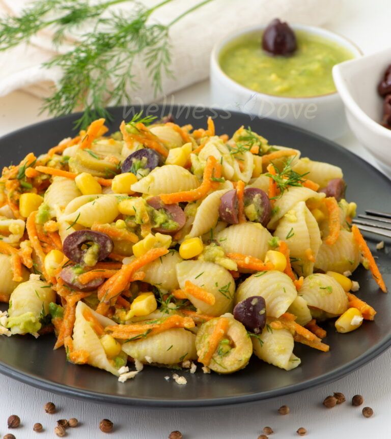 creamy vegan pasta salad served on a black plate