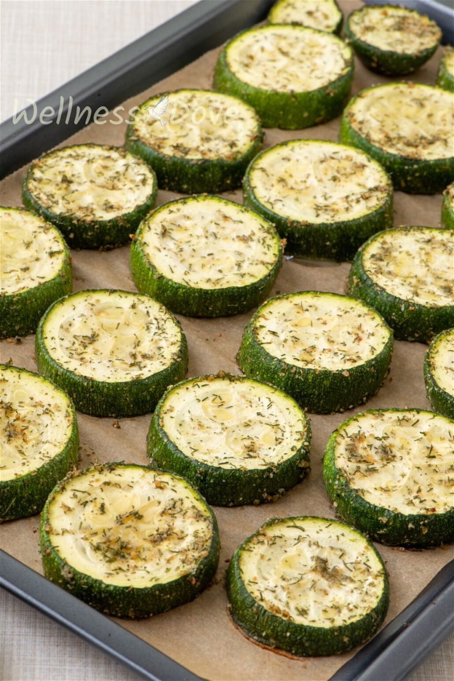 a 3/4 view of a pan with roasted vegan zucchini