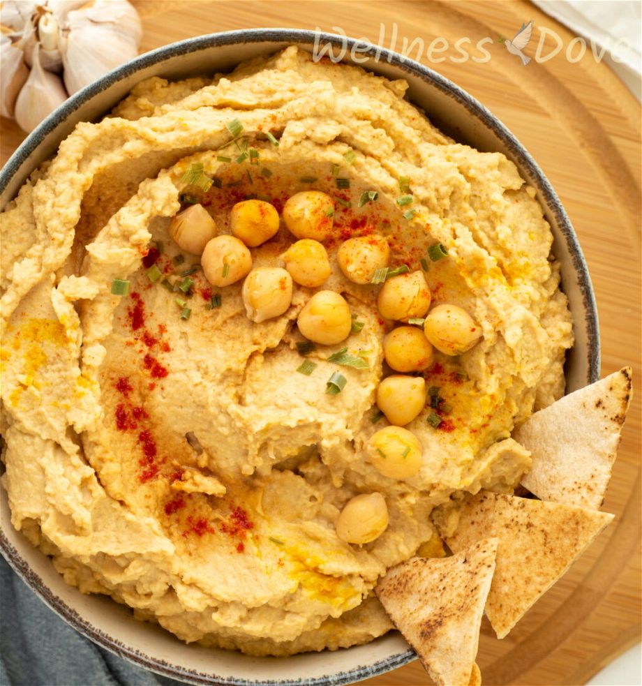 5 ingredient oil-free vegan hummus on a chopping board, overhead view