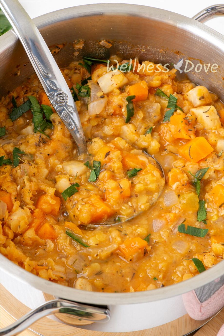 close up 3/4 view of the easy red lentils vegan soup in a pot