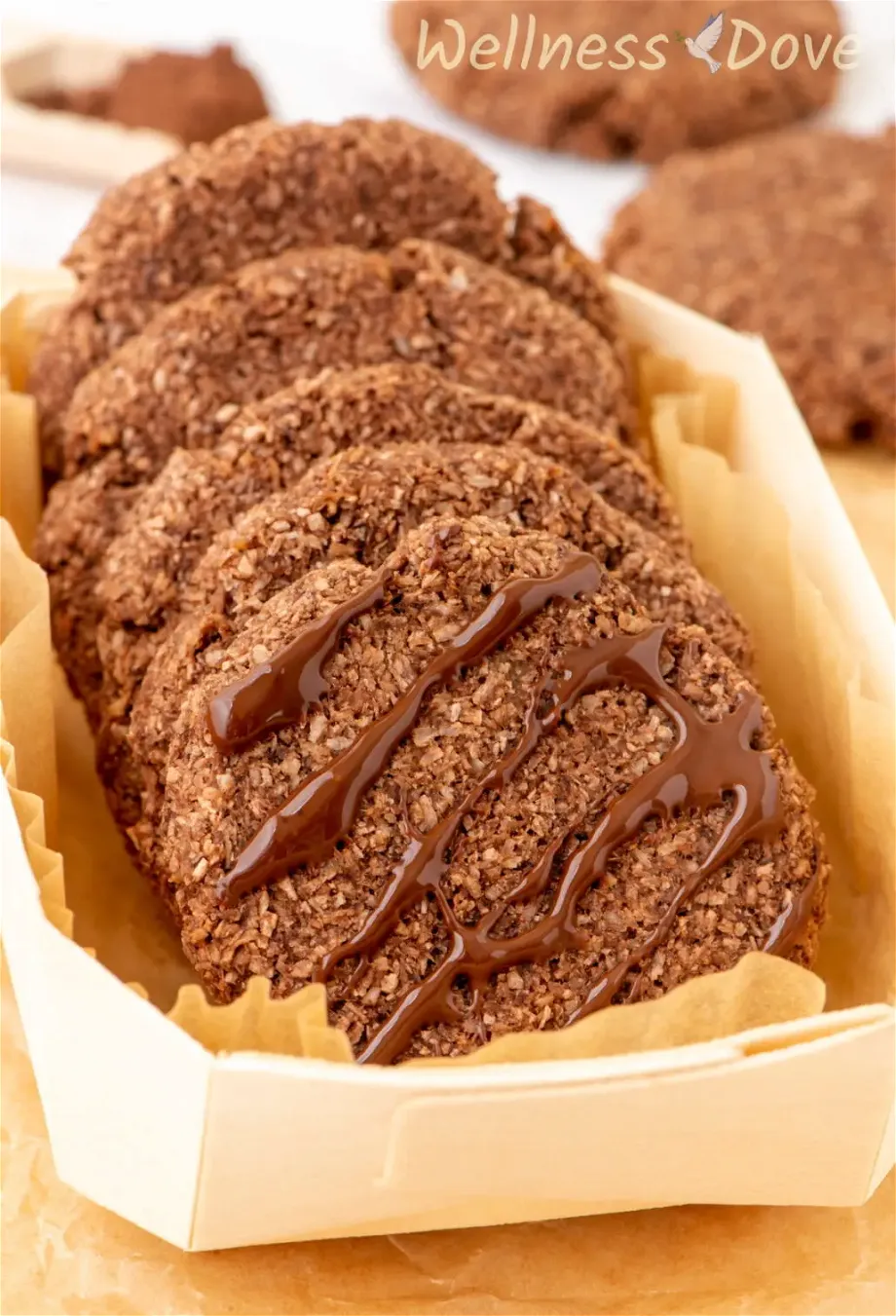 the easy 3 ingredient vegan coconut cookies in a small wooden dish.