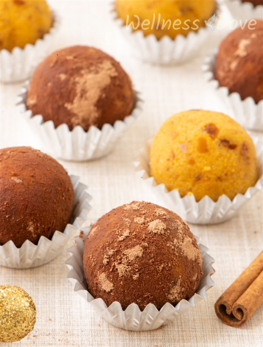 a close up of the easy vegan pumpkin truffles in paper cups