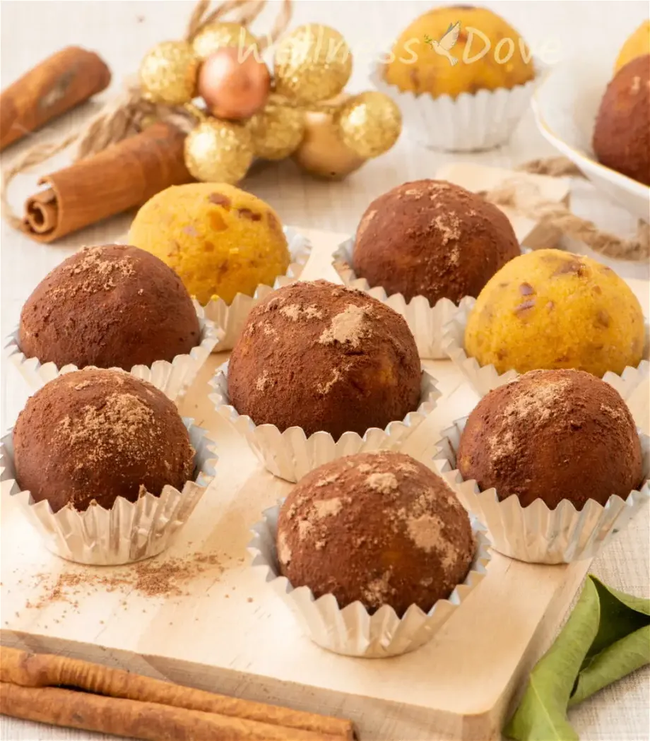 the easy vegan pumpkin truffles on a small chopping board