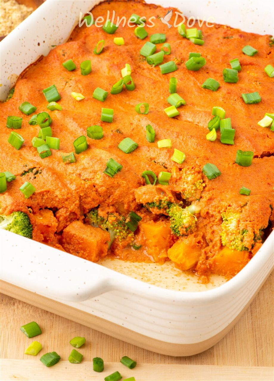 a close up photo of the vegan broccoli casserole in a baking dish