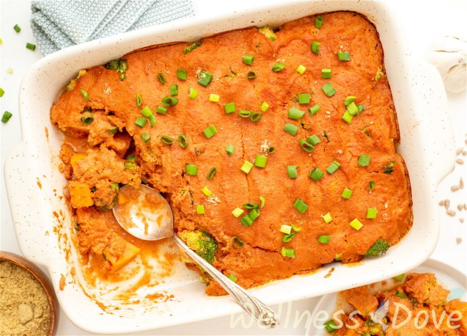 an overhead view of the  vegan broccoli casserole with a some of it taken out