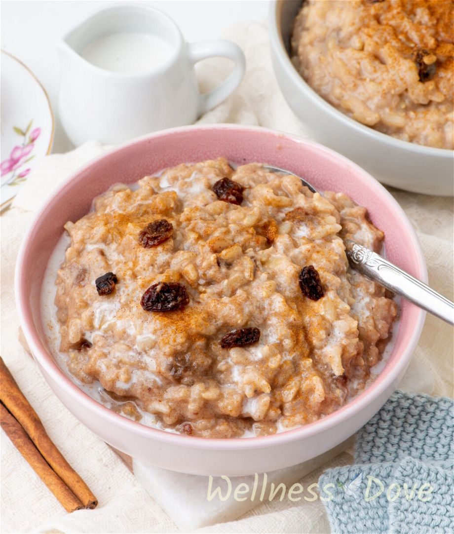 a close up, 3/4 angle view of the  quick vegan brown rice pudding in a purple bowl