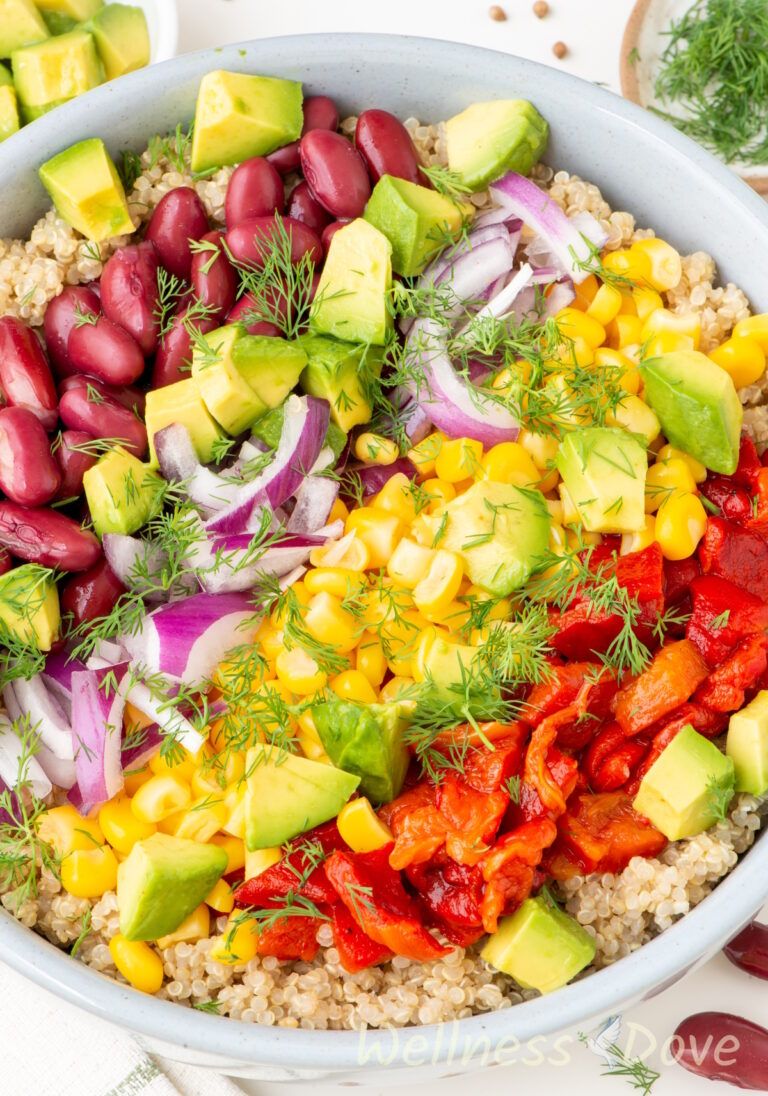 a macro shot of the vegan avocado quinoa salad before it is tossed