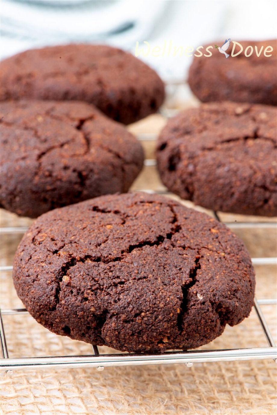 the Easy Chocolate Almond Vegan Cookies on a cooling rack, close up view