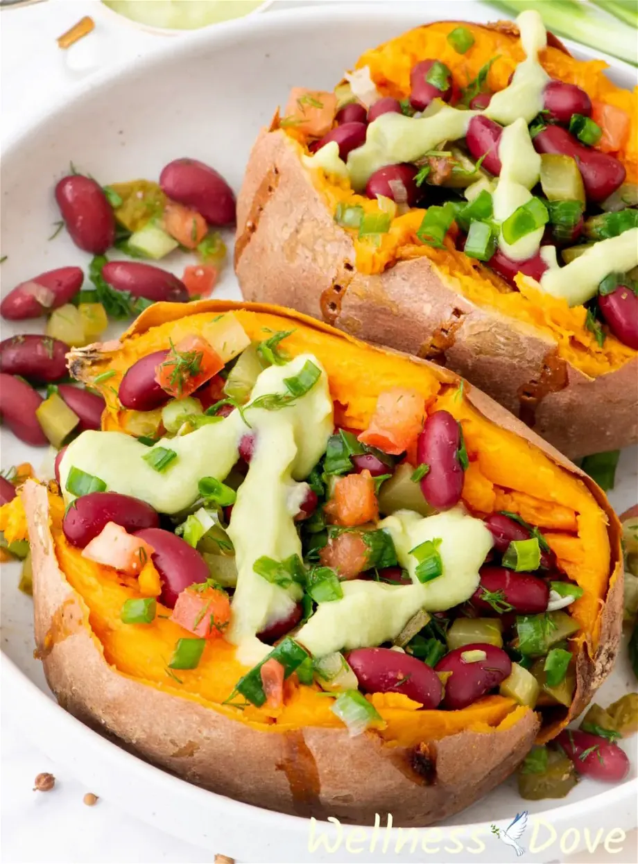 a macro shot of one of the bean stuffed vegan sweet potatoes   on a chopping board