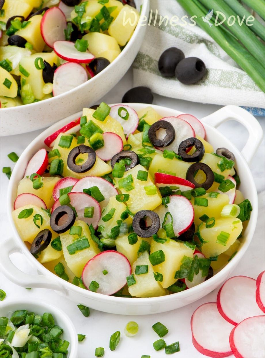 the vegan no mayo potato salad in a small bowl, 3/4 angle shot