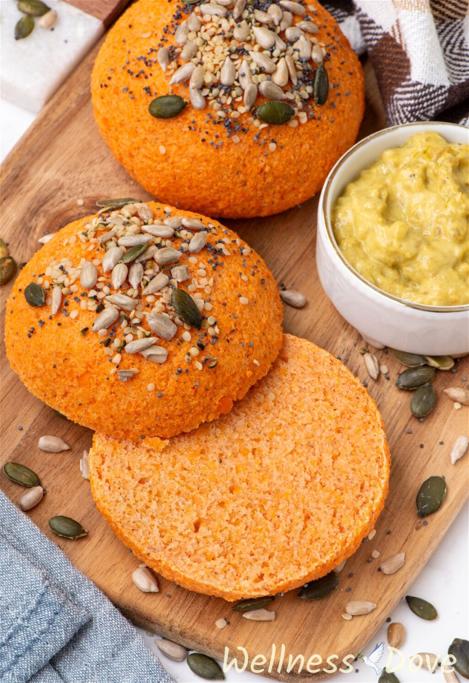 a photo of one of the Quick Vegan Lentil Bread Rolls cut in half on top of a board