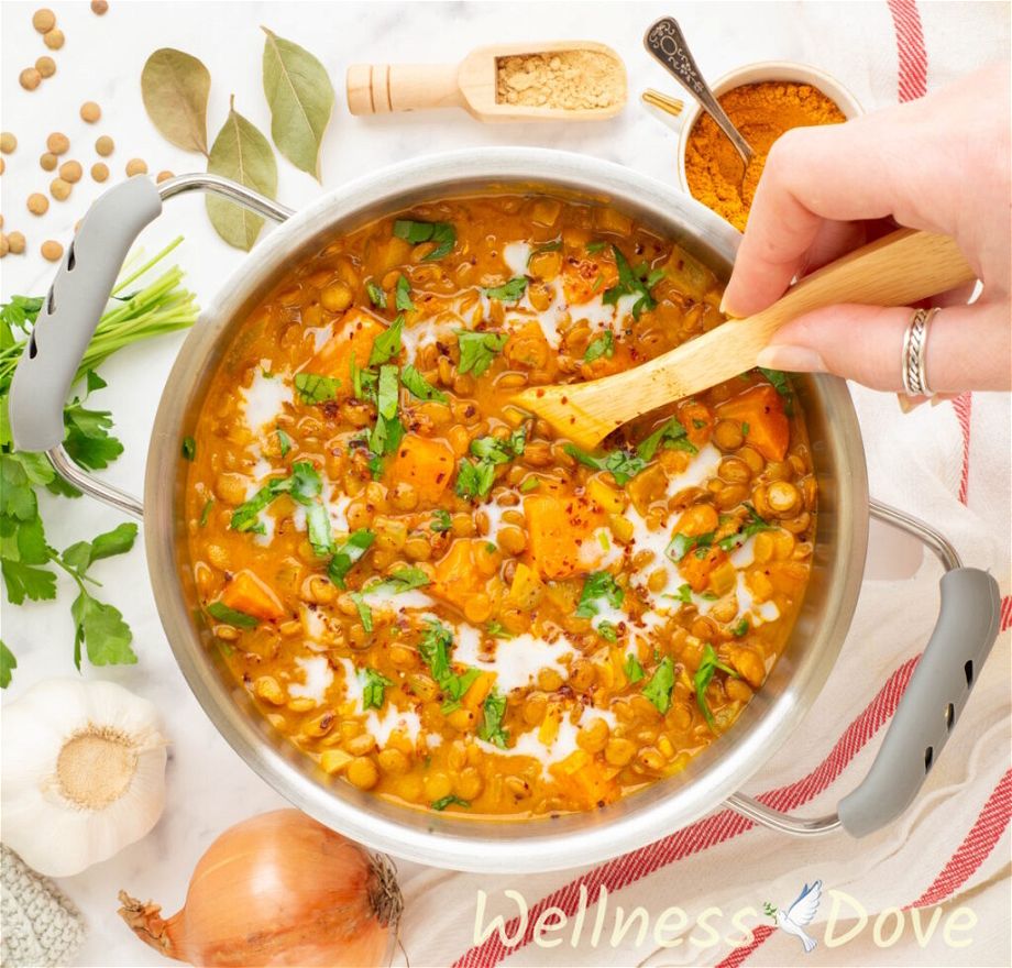 an overhead photo of the Wholesome Sweet Potato Lentil Vegan Curry in a smaller pot